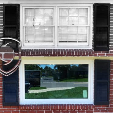 Tampa window replacement before and after of old single-pane sinle-hung windows, professionally replaced by DuraSash Windows Installation Experts. The after photo shows DuraSash Tampa window craftsmanship with a professional caulking job on PGT hurricane impact energy efficient 5500 picture fixed window series.