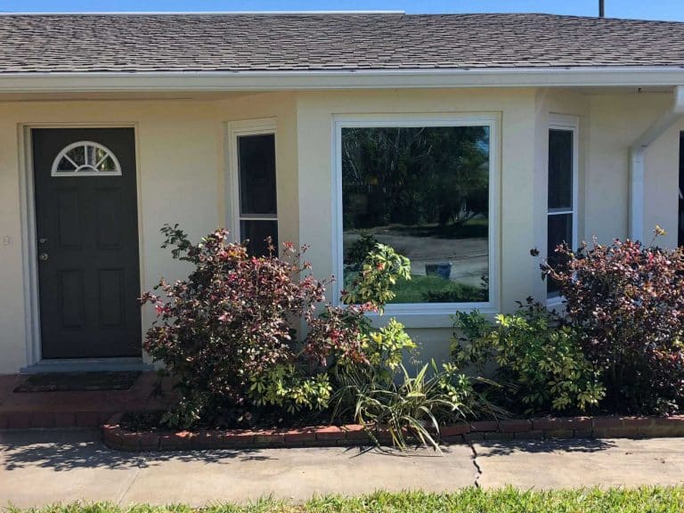 Double Hung and fixed picture window with energy efficient, hurricane impact glass Replaced by DuraSash Windows located in Tampa, FL serving Hernando County, Pinellas County, Hillsborough County, and Pasco County.
